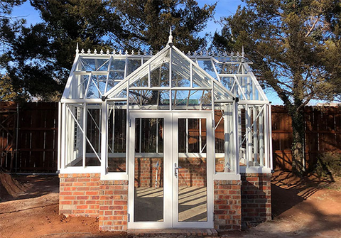 A T-shaped greenhouse in white color