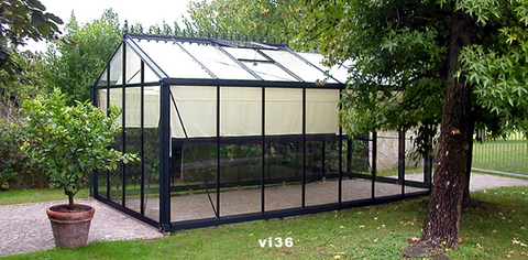 A new Exaco VI36 greenhouse installed in a backyard