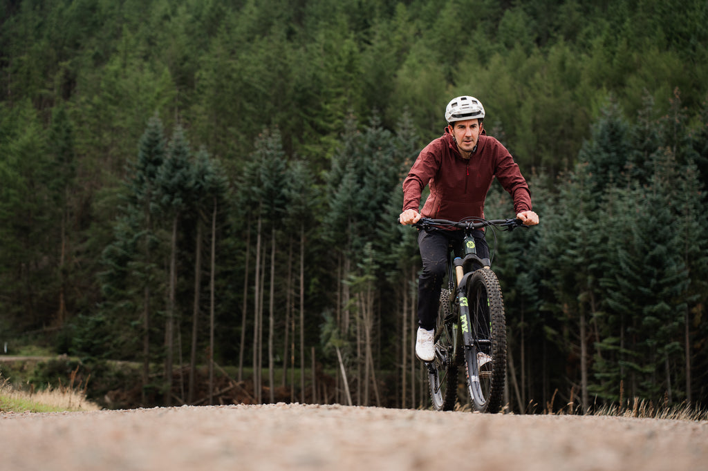 Neil pedalling up the Golfie in Innerleithen, wearing his Chilco Anorak