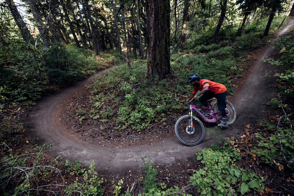 Santa Cruz Heckler SL flowing through forest singletrack