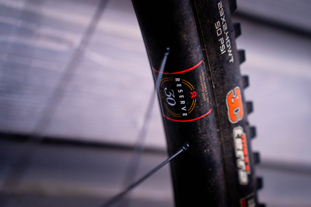 Reserve alloy sticker with Maxxis hotpatch logos visible on the tyre sidewall