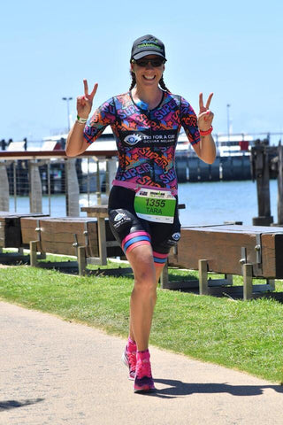 Tara finishing her second ironman 70.3 cairns