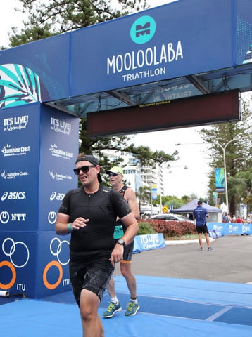 Jake Lynch finishing his first every triathlon at Mooloolaba