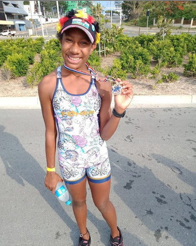 FOHER Co swim ride run Ambassador Zeetah Nuttall after winning her sprint title at the Papua New Guinea championships