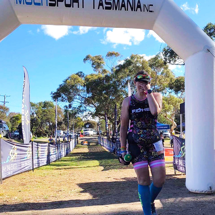 Georgie finishing her first Half Ironman