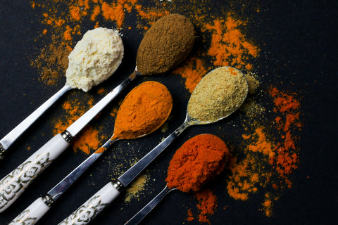 A variety of spices in spoons