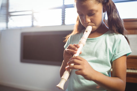 Girl flutist on the flute