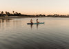 Couple Kneeling On The Megalodon Paddle Board