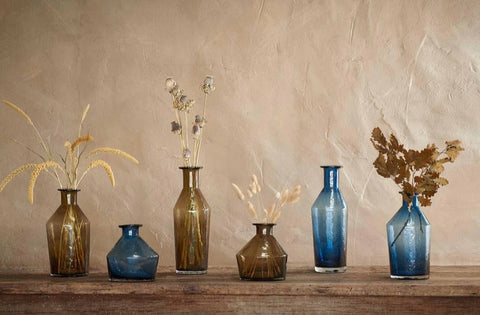 Eco recycled vases in blue and brown for dried flowes against a brown background from our eco shop