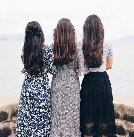 Three women standing together for international women's day