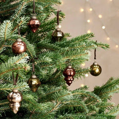 Eco-friendly recycled glass Christmas tree decorations on a real Christmas tree