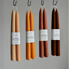 Four dining candles presented as sustainable Christmas stocking fillers