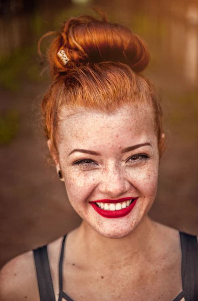 woman smiling with red lipstick