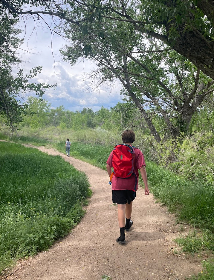 boy hiking on a trail 