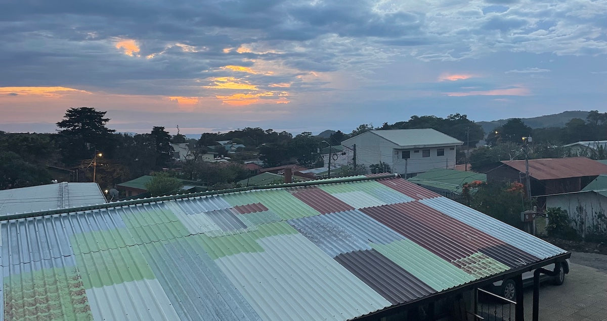 costa rica sunset over roof