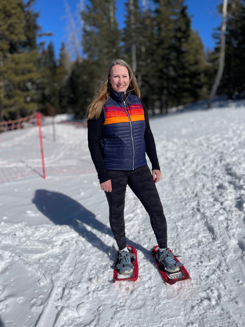 A woman snowshoeing 