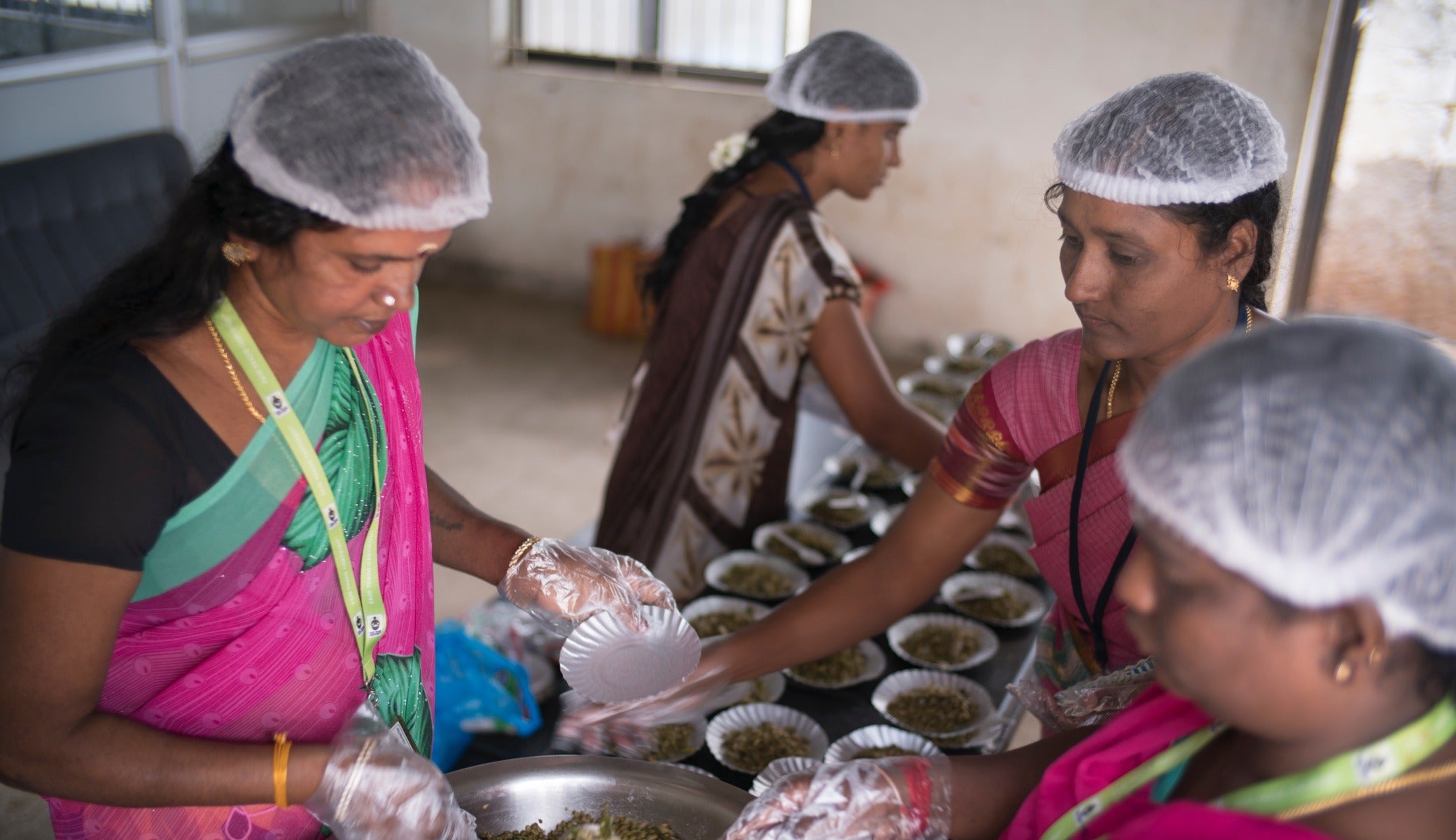 Steamed green bean sprouts are prepared as part of a free meal program started by the Fair Trade committee.