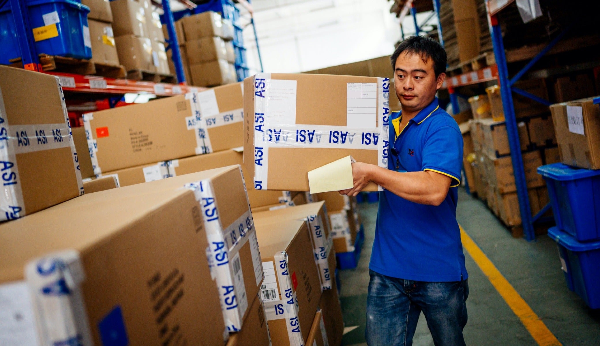 Fair Trade at ASI has enabled warehouse worker Zhu Fang to buy better groceries using the dividends 