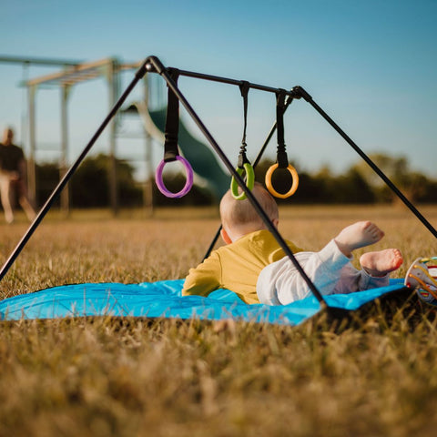 Baby at playground on Lay and Play Adventure Mat