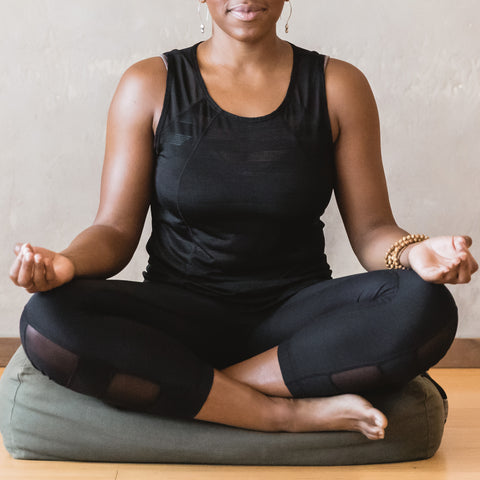 black woman doing yoga