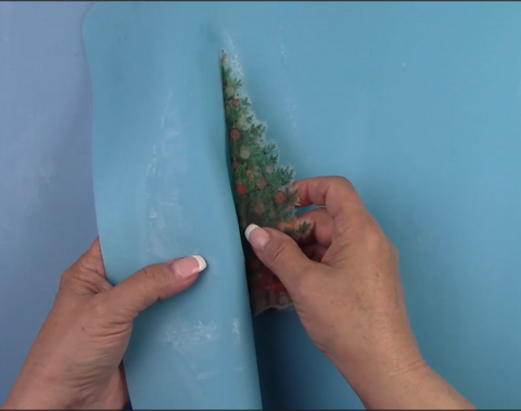 Peeling napkin off of the silicone matt with the polyvine backing