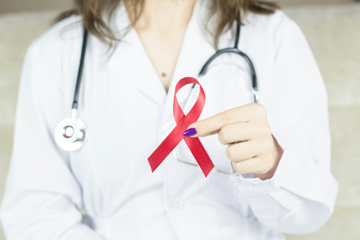 doctor holding HIV ribbon