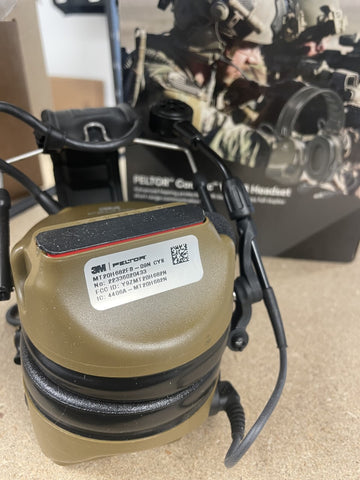 warranty and seriel number sticker on the earcup of a 3m peltor comtac v headset