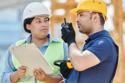 Construction workers using a radio