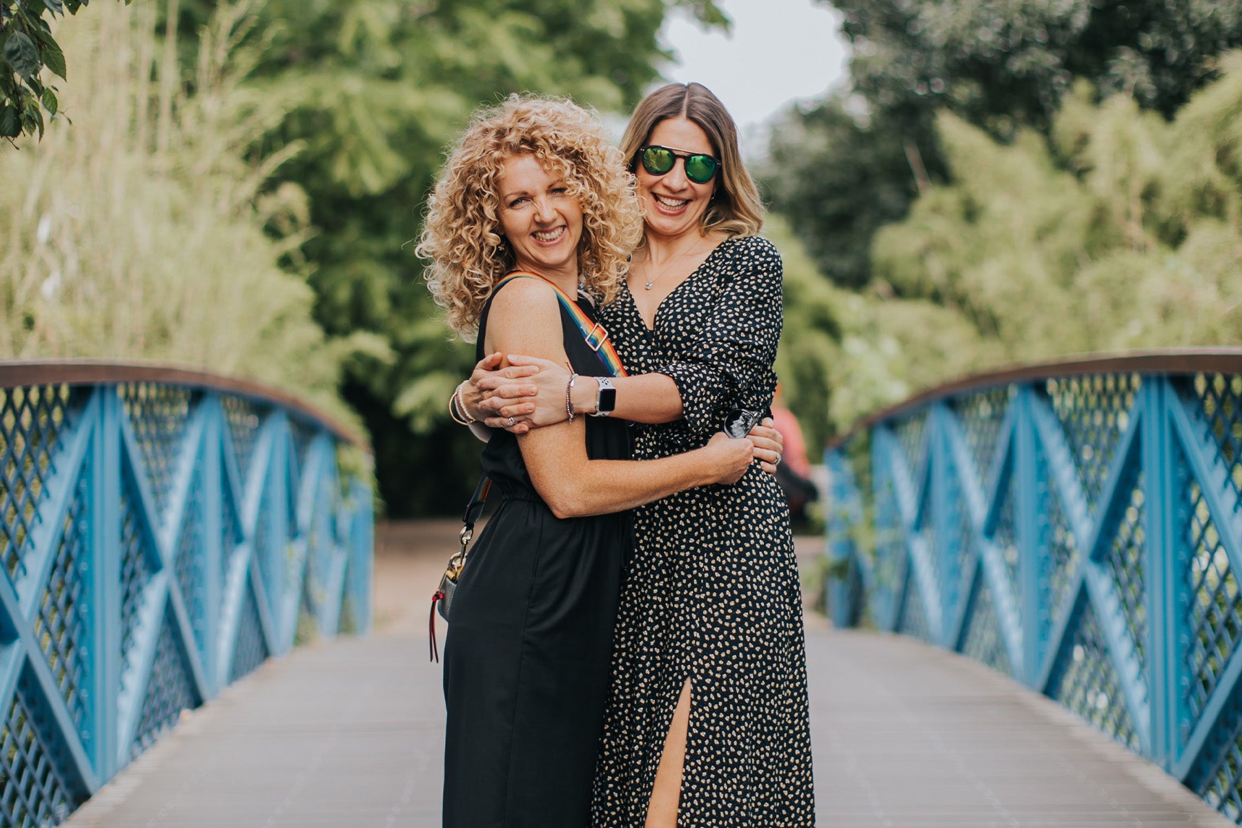 Bloom and Blossom founders on a bridge.