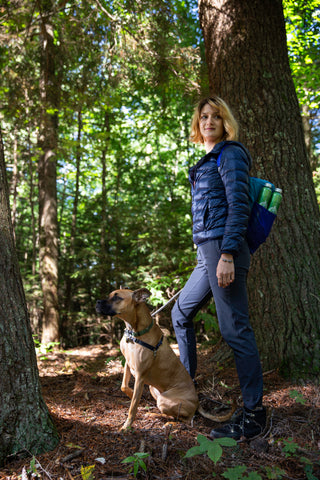 Dog hiking in woods