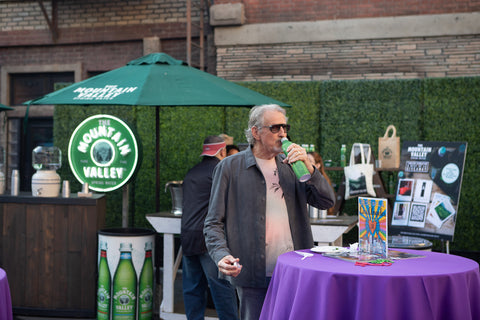 Man drinking Mountain Valley at the event