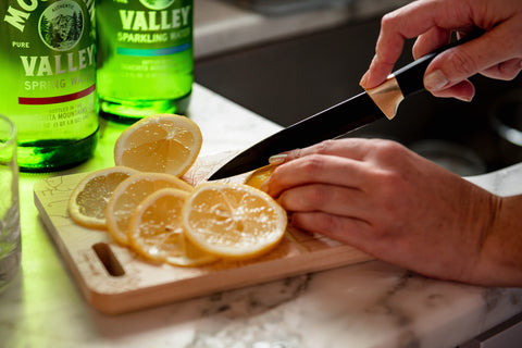 Mountain Valley Spring Water bottles with cutting board and lemons