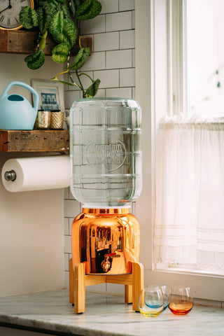Beautiful rose gold dispenser with Mountain Valley Spring Water 5 gallon