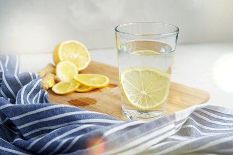 Glass of water with lemons