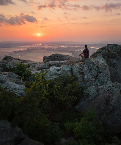 Ouachita Mountains view of woman with Mountain Valley bottle