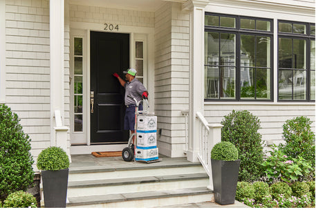 Man delivering water to a home