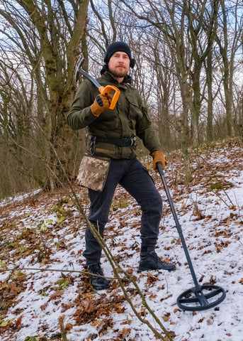 Man with a metal detector.