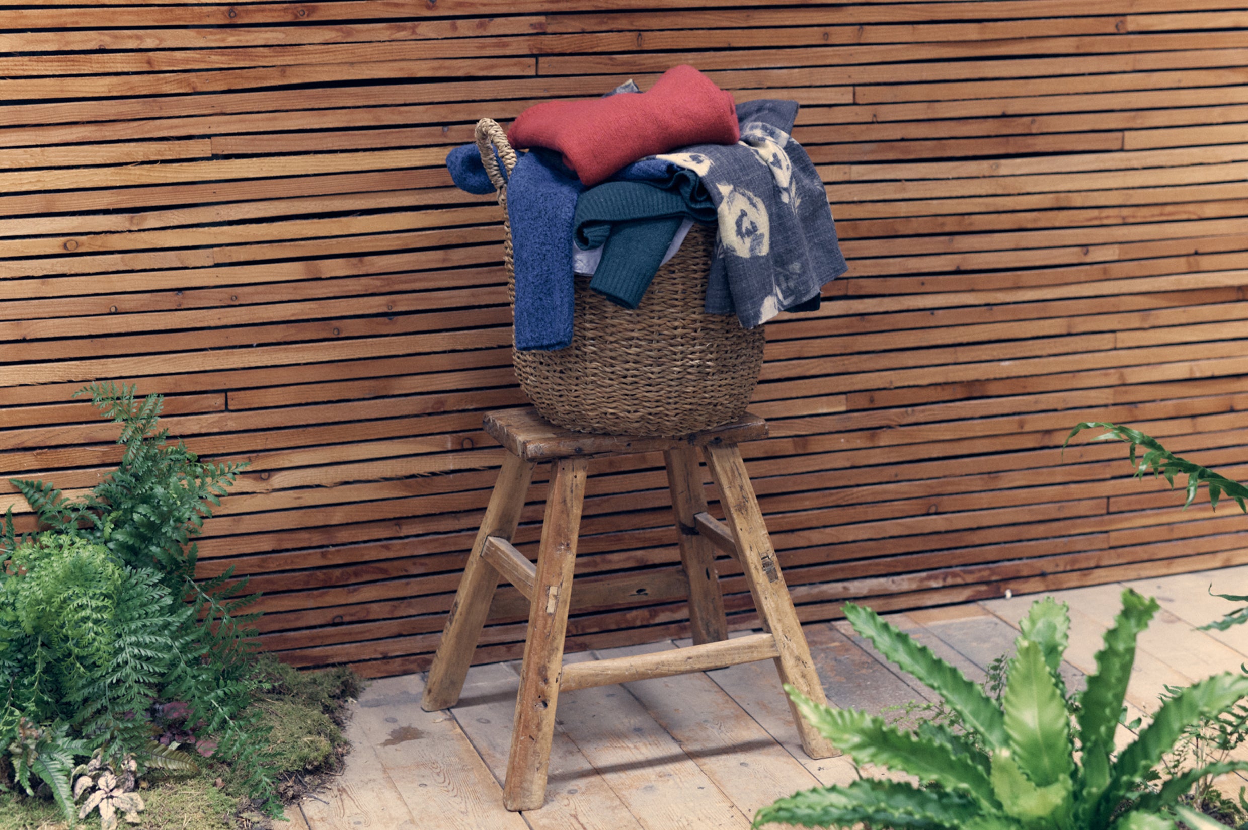 A basket of clothing on a stool