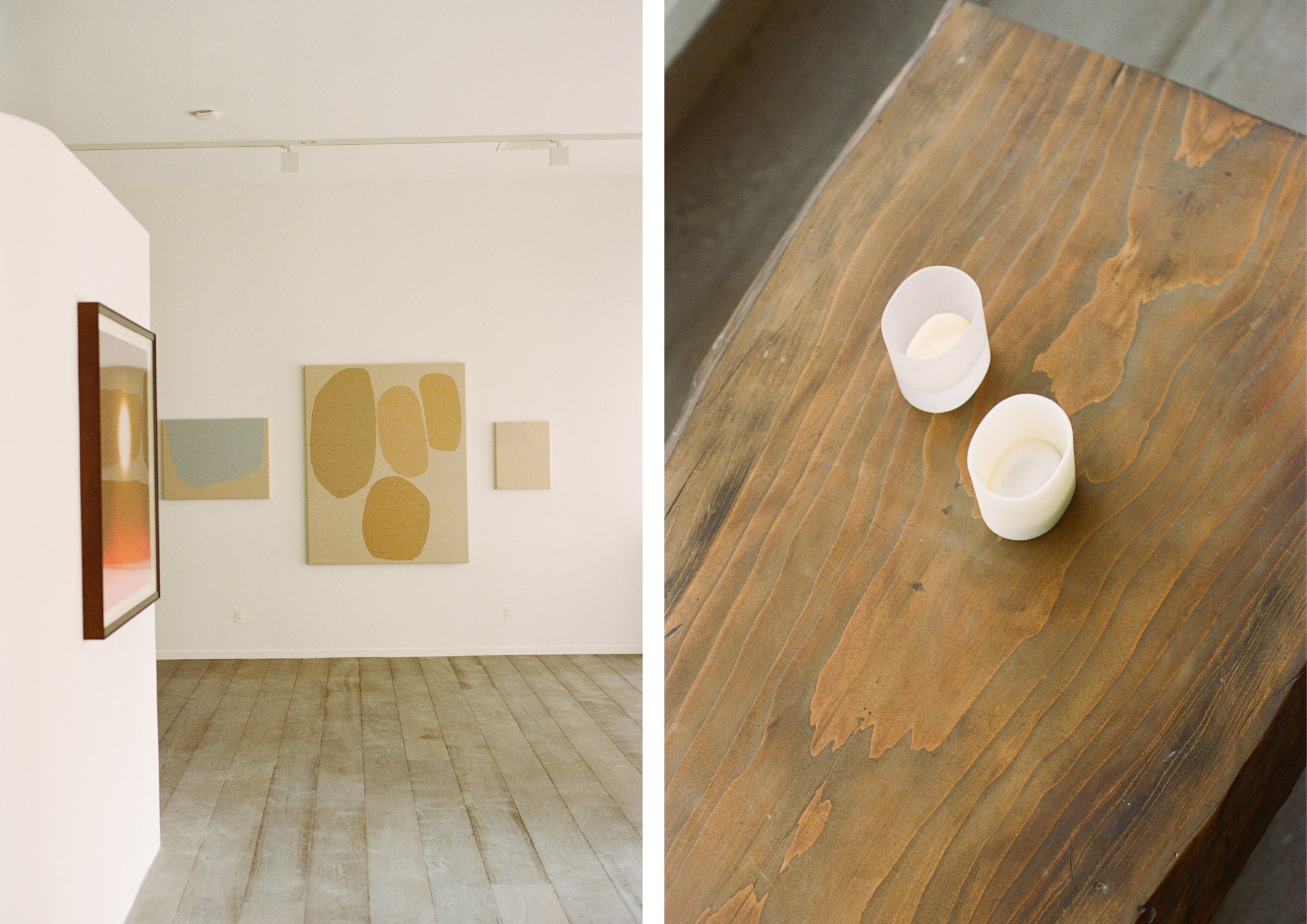 Art in a gallery and wooden table