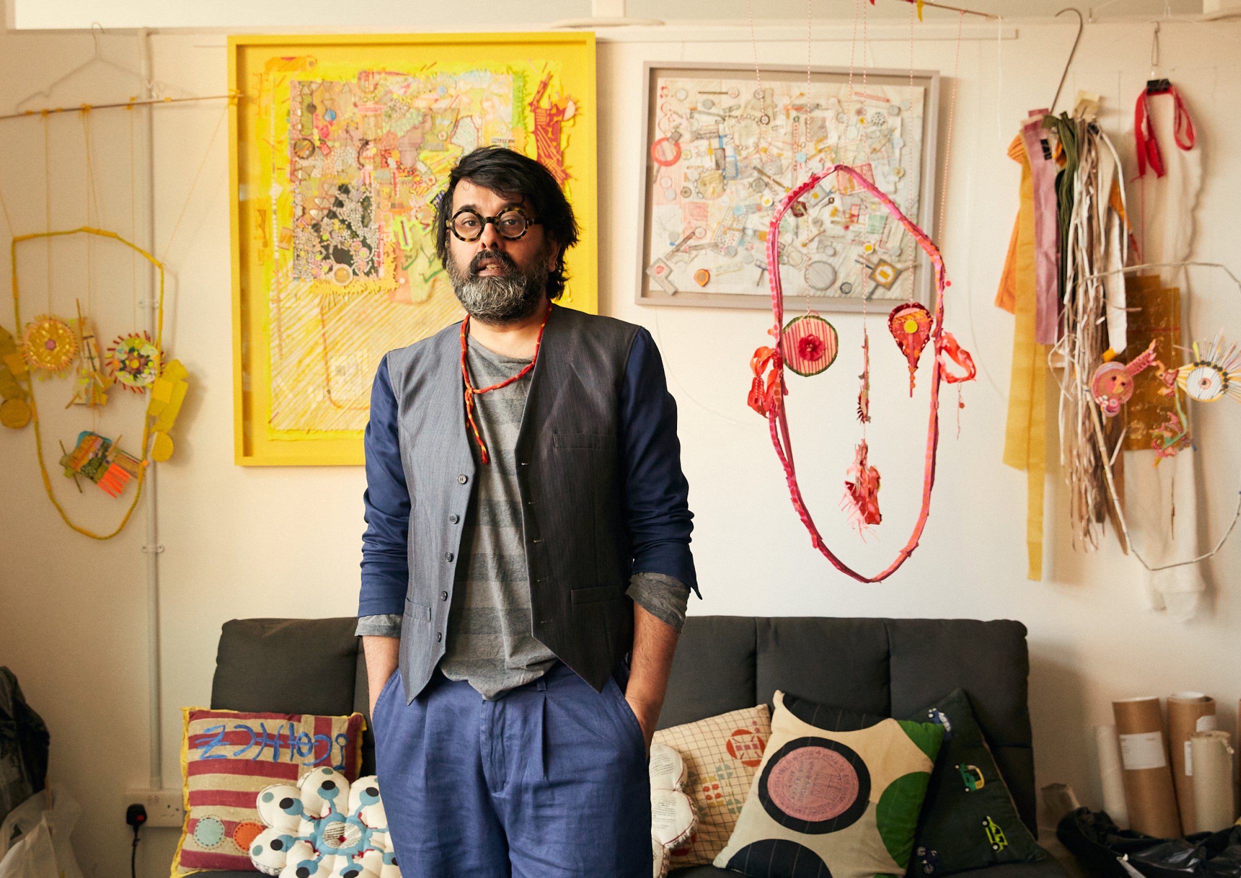 Man stood in front of sofa and cushions