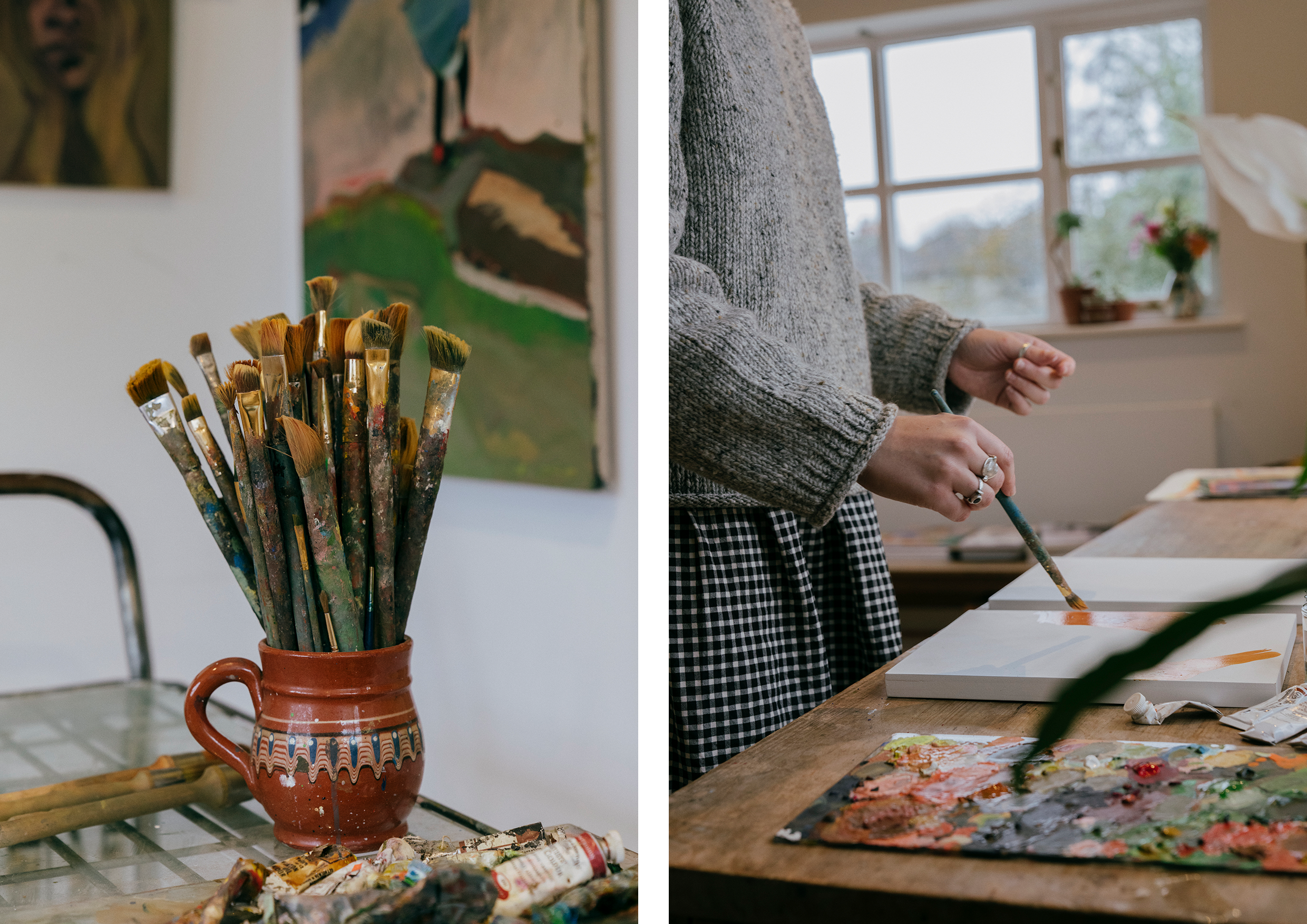 Paint brushes in a red pot.