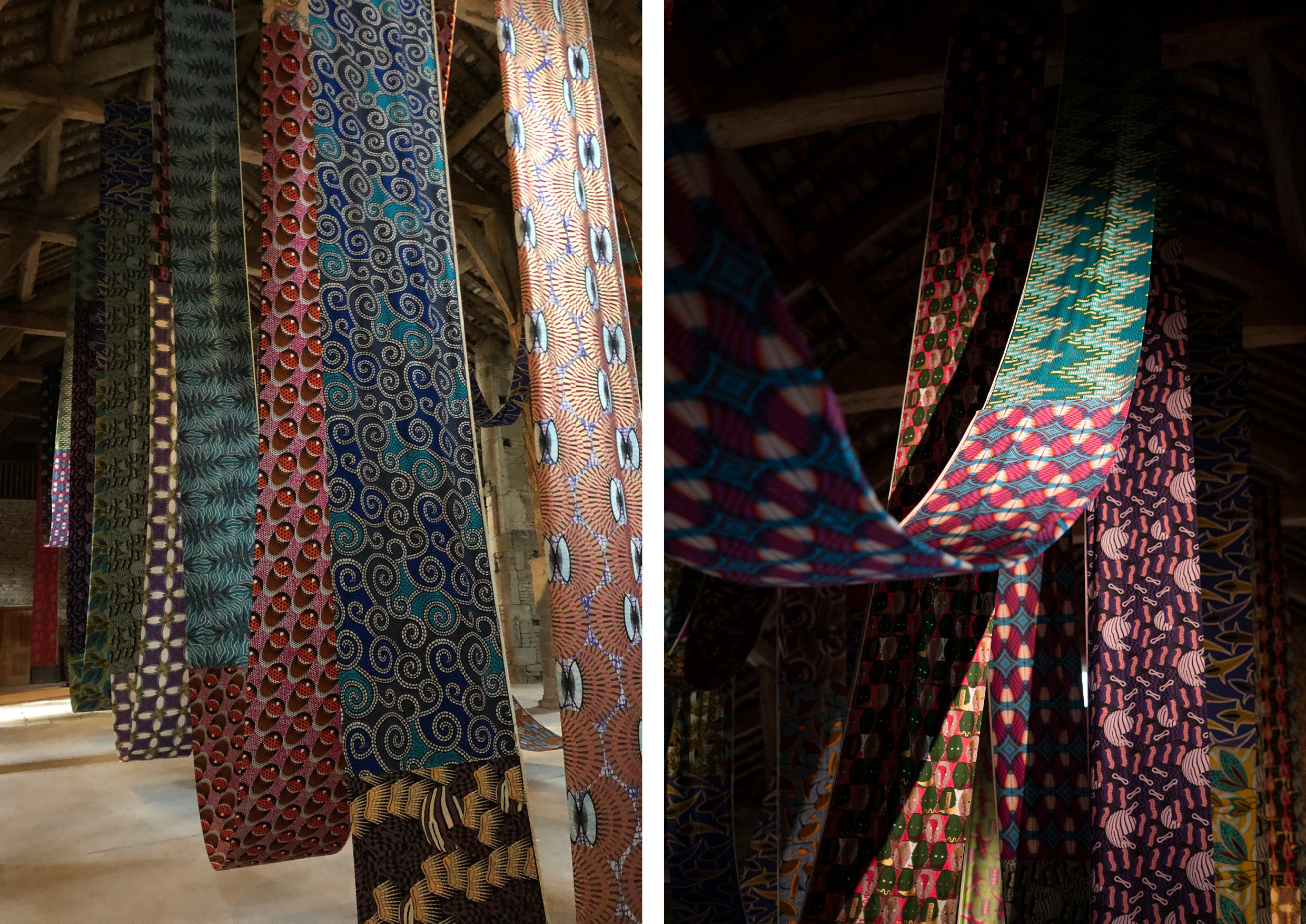 Reems of printed textiles hung in an exhibition space