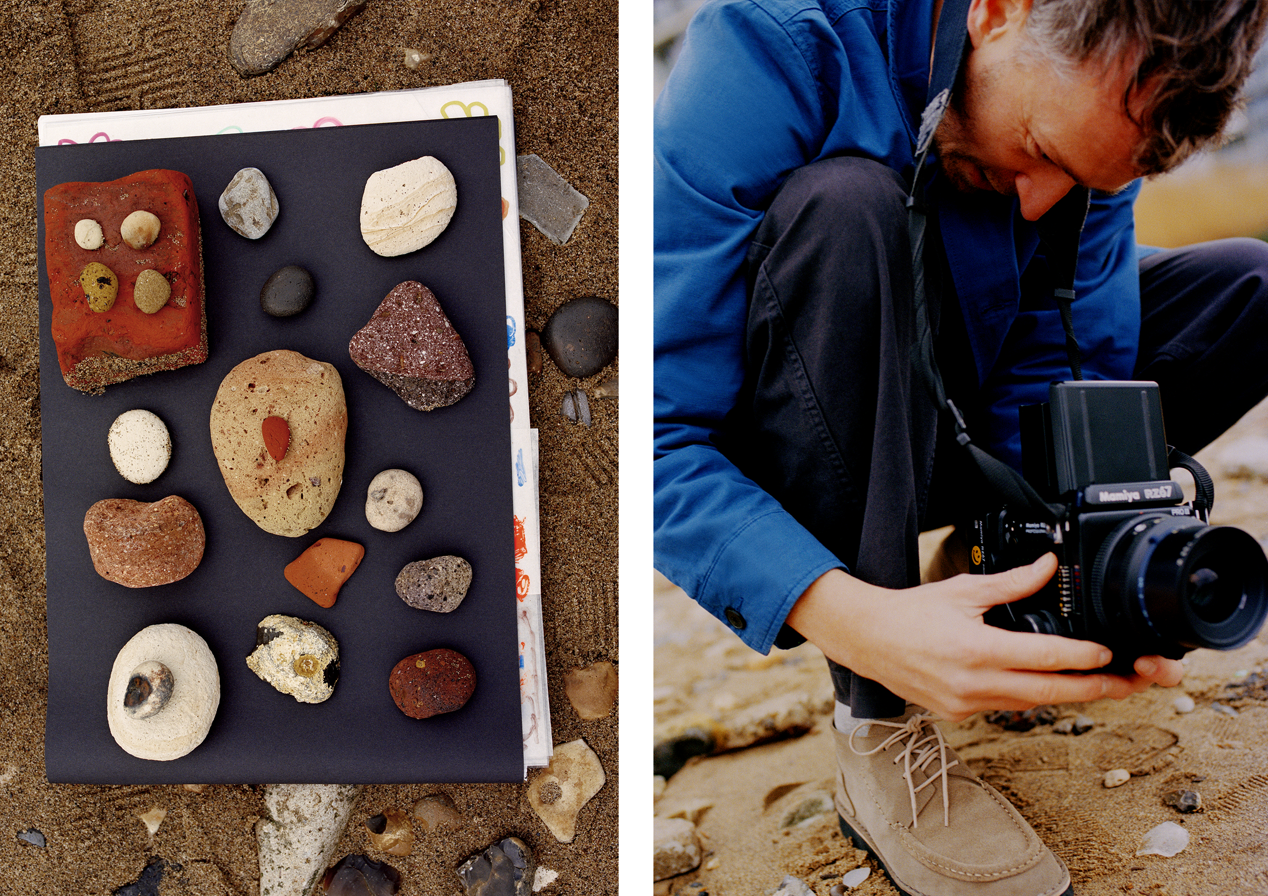 Stones laid out on a beach; man in blue shirt taking photographs