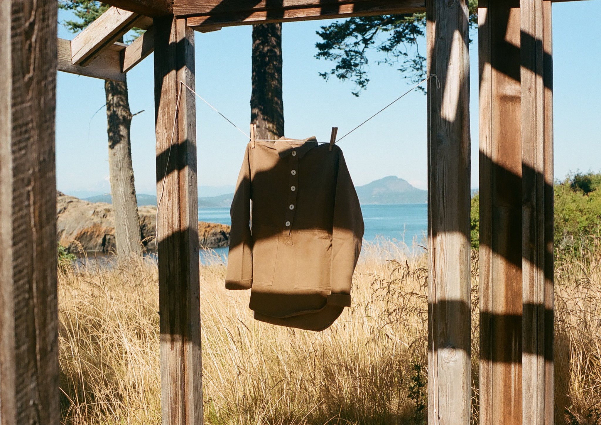 A brown shirt hanging in the open