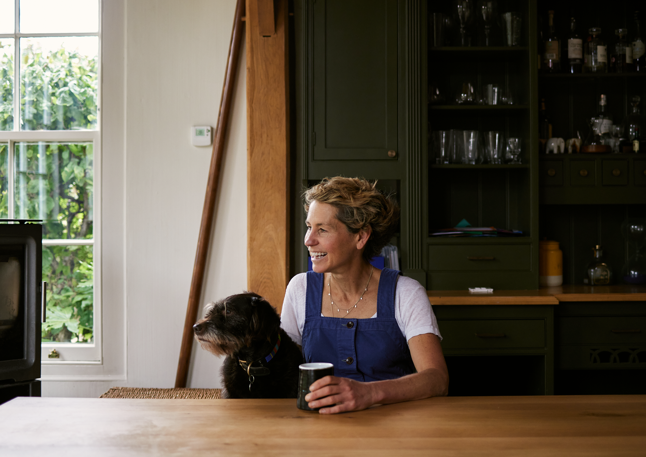 Food writer Tara Wigley at at table with her dog