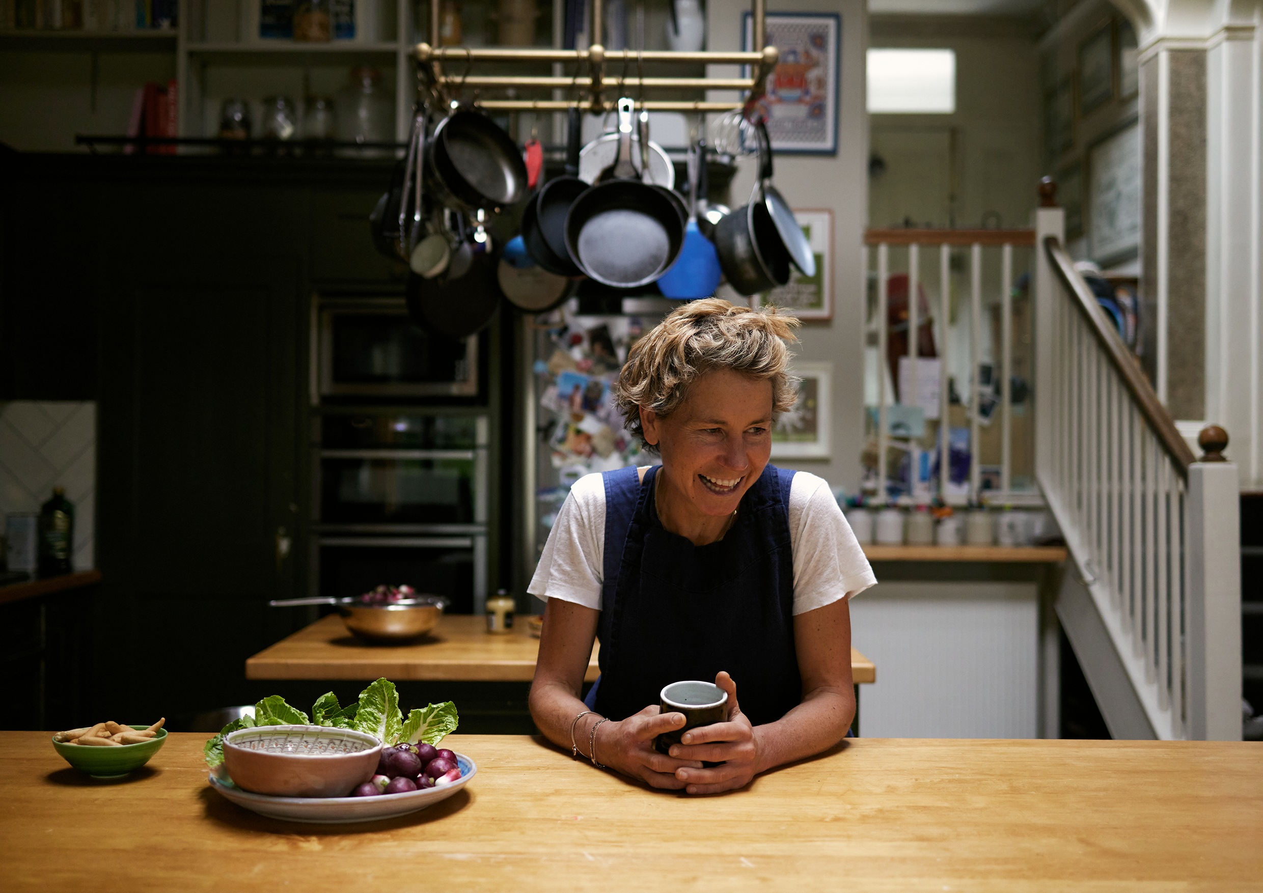 Food writer Tara Wigley with cup of tea in the kitchen