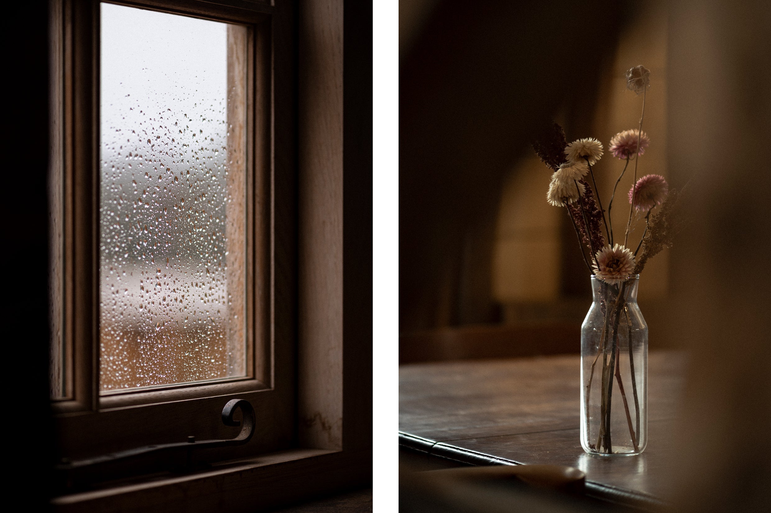 A window with raindrops and a vase of flowers