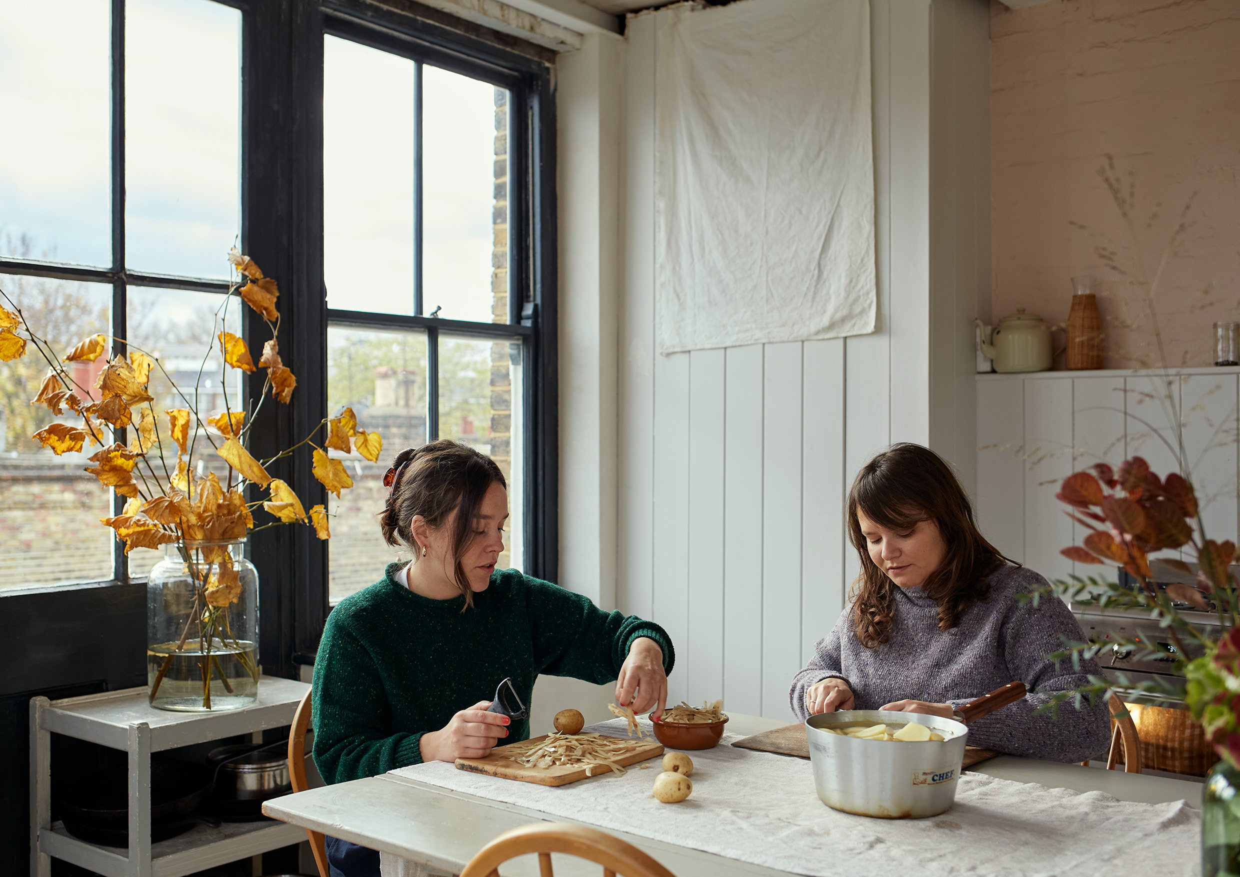 Two women prepping food