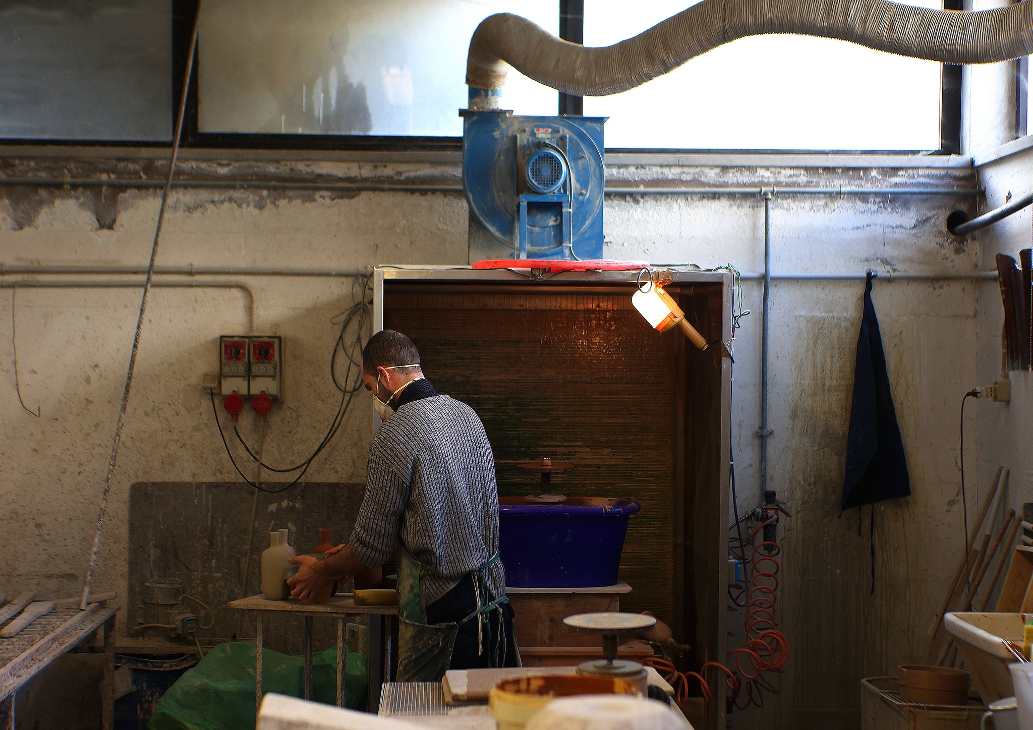 Man working in a pottery studio