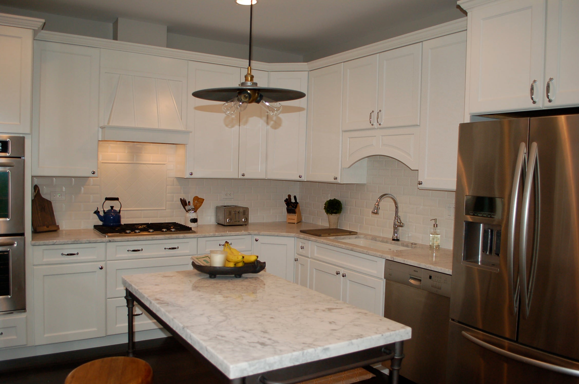white kitchen, carrara counters, marble counters, kitchen lighting